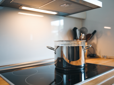 How much will switching to an induction hob and efficient ventilation actually reduce your home's emissions?